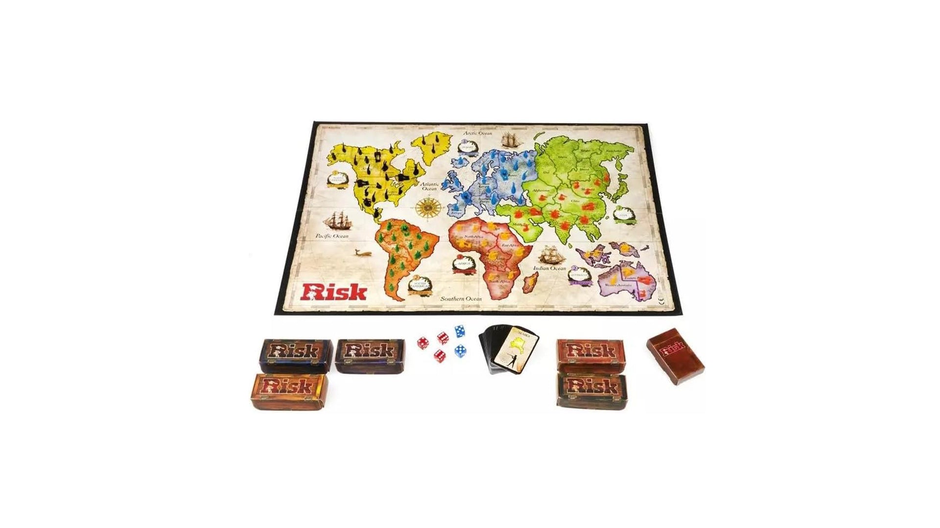 The complete contents of the classic Risk board game, showing the world map game board, the card boxes, dice, and playing cards all laid out.